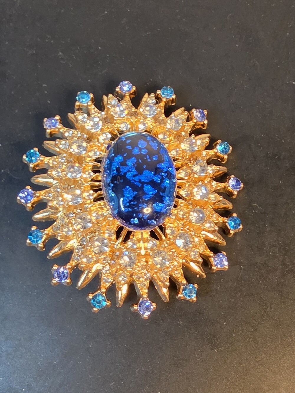 Gold Sunburst Brooch with Deep Blue Center
